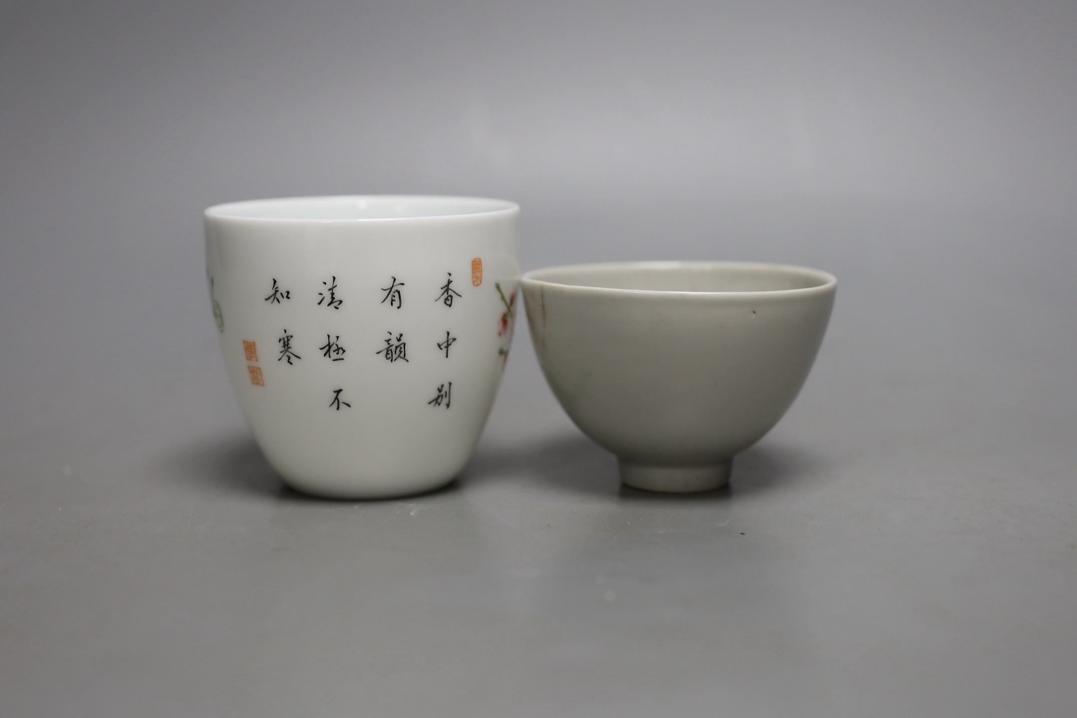 A Chinese internally moulded porcelain cup and a famille rose cup, 7cms high